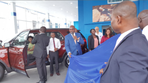 The General Manager, Marketing and Corporate Services, Coscharis Group, Mr. Abiona Babarinde (middle) unveiling the 2016 Ford Figo to the admiration of his guests