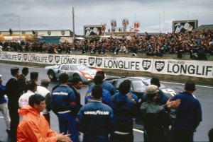 1966-le-mans-first-and-second-place-cars-pass-ford-pits