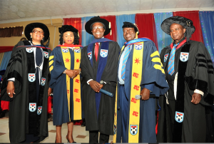 Maduka (middle) flanked by ABUAD officials