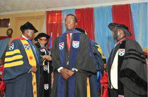 Dr. Maduka being decorated at the ceremony