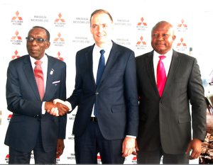 The Managing Director, Massilia Motors Limited, Mr. Thomas Pelletier (middle), congratulates the Deputy Managing Director, Kewalram Chanrai Group, Mr. Victor Eburajolo (left), as the Deputy Managing Director, Massilia Motors Limited, Mr. Kunle Jaiyesimi (right) , smiles at the development at a media briefing to announce the position of Massilia Motors Limited as the sole distributor of Mitsubishi vehicles in Nigeria… at Mitsubishi showroom, Victoria Island, Lagos …Thursday