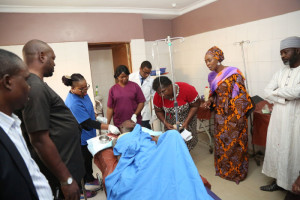 Mrs. Saraki watches as the-victim of hit and run-driver is being attended to at the Kubwa-Hospital in Abuja