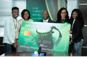 MD, Heritage Bank Plc, Ifie Sekibo,  (middle) flanked from the right by Bisola Ayeola (Bisola), Efe Ejegba (Efe), from left Tokunbo Idowu (TBoss) and Oluwarise Deborah (Debbie Rise), during the presentation of financial investment support to the Big Brother Naija 5-top finalists at Heritage Bank's Head Office, in Lagos...recently 