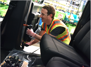 Mark Zuckerberg works on the F-150 assembly line during the visit to Ford's Dearborn Truck Plant