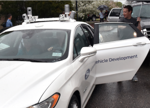  Zuckerberg takes a ride in a Fusion Hybrid autonomous research vehicle at Ford's Product Development Center in Dearborn