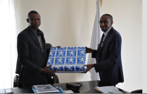 Managing Director, PAN Nigeria Limited, Alhaji Ibrahim Boyi (right) ,presents a gift to the Director General, NADDC, Mr. Jelani Aliyu, during the visit