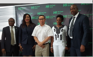 From left:  Mr. Jude Monye, Executive Director Business Banking; Mrs. Adaeze Udensi, Executive Director; Retail & SME Bank; both representing the MD/CEO of Heritage Bank Plc, Mr. Ifie Sekibo; the General Manager, Biase Plantations Limited (BPL), Mr. Ahmad Mustaffa Goh, Out-grower Officer BPL, Miss Solange Wankwi and Corporate Affairs Manager, Mr. Antigha Essien Esiet, at the signing ceremony of the N232million Pilot Out-growers' Agreement between the Bank and Biase Plantations Limited at Heritage Bank's Head Office, Lagos….weekend