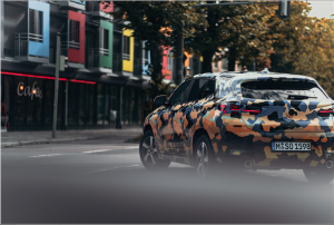 The new BMW X2 goes through the city in an extravagant digital camouflage design