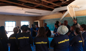 Goodyear employees in the classroom which will be renovated to relieve the pressure of the ever increasing number of learners 