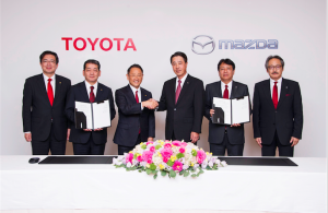 Toyota President and CEO, Akio Toyoda and Mazda President and CEO, Masamichi Kogai, are joined by top executives of both companies to celebrate the partnership agreement at the ceremony in Tokyo...Friday