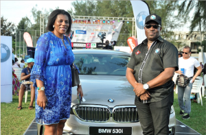 General Manager, Marketing and Communication Services, Coscharis Group, Abiona Babarinde (right), with a top BMW lover at the launch of the "Business Athlete" in Lagos