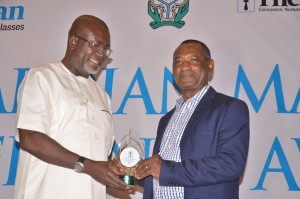 Dr Martins Ogwuda of the Central Bank of Nigeria (left), representing Mr Godwin Emefiele, CBN Governor; presenting the Guardian Manufacturer Excellence Awards 2017 to Mr. Taiye Williams, Managing Director Lubcon International on Friday November 17, 2017 at the Eko Hotel & Suites, Victoria Island, Lagos. 
