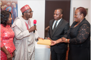 From left: Mrs. Mina Ize-Iyamu, Mr. Godwin Ize-Iyamu, Chairman, ECOBA Lagos presenting the Distinguished Old Boy of the Year Award to Mr. Aigbe Olotu supported by his wife, Mrs. Yinka Olotu, at the 2017 Annual Dinner of Edo College Old Boys Association (ECOBA) Lagos Branch which held  at the Metropolitan Club, Lagos… last weekend 